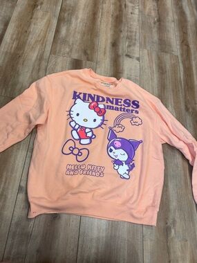 Hello Kitty Peach Crewneck Sweater with Purple Graphic